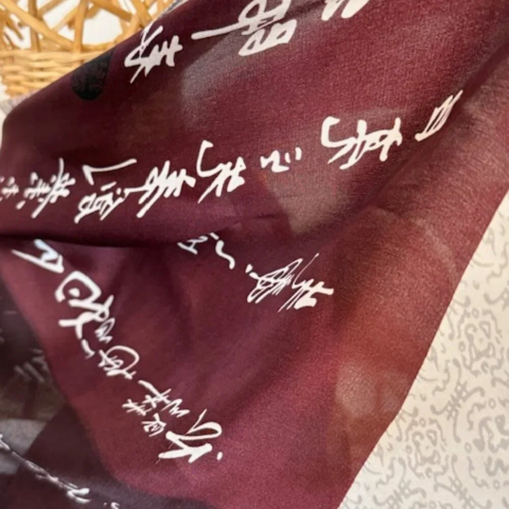 100% silk wine colored and silver oblong scarf.